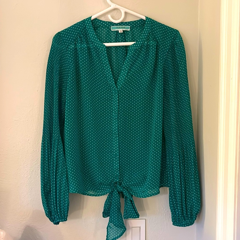 Sheer green button down blouse with tie in front and bell sleeve at the bottom